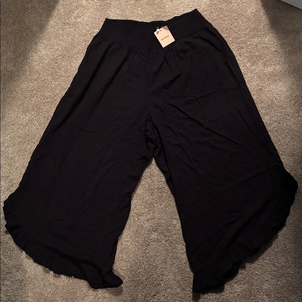 Bloom Chic Black Wide-Leg Pants with Ruffle Hem